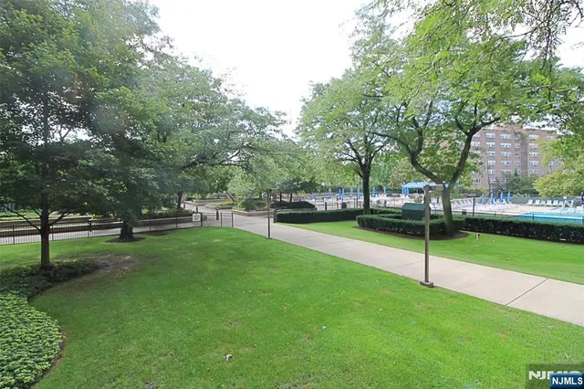 a view of a hallway with closet and a couch