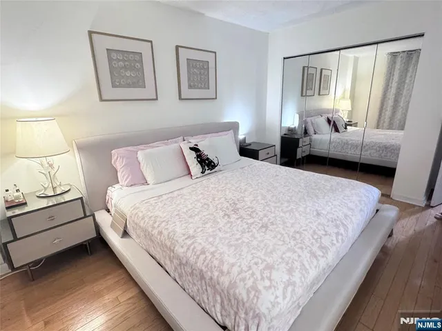 a bedroom with bed and window