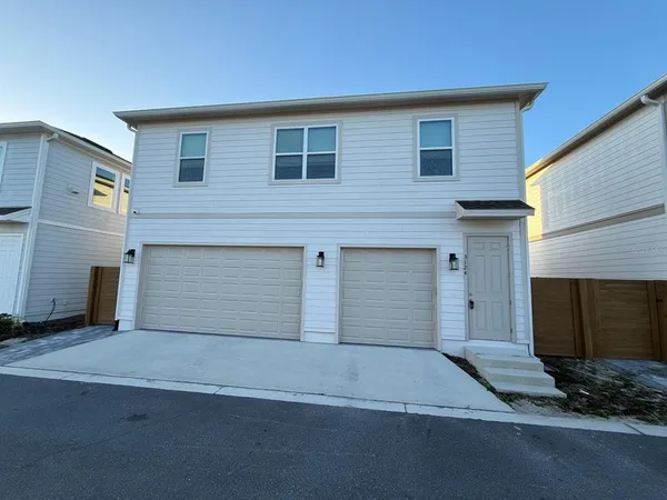 a front view of a house with garage