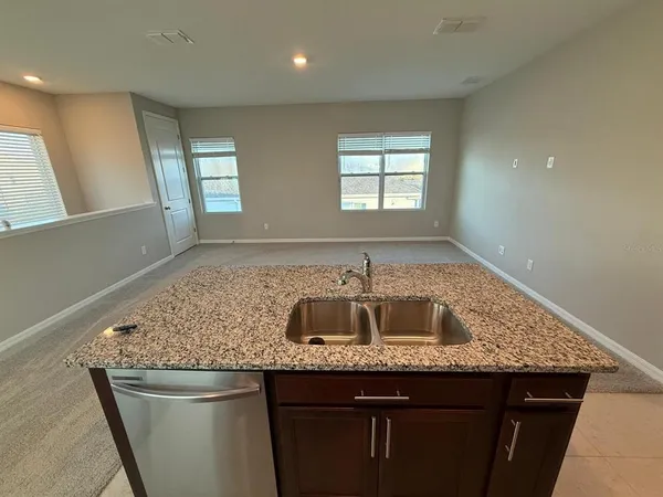 a kitchen with sink and window