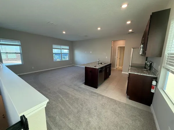 a living room with furniture window and flat screen tv