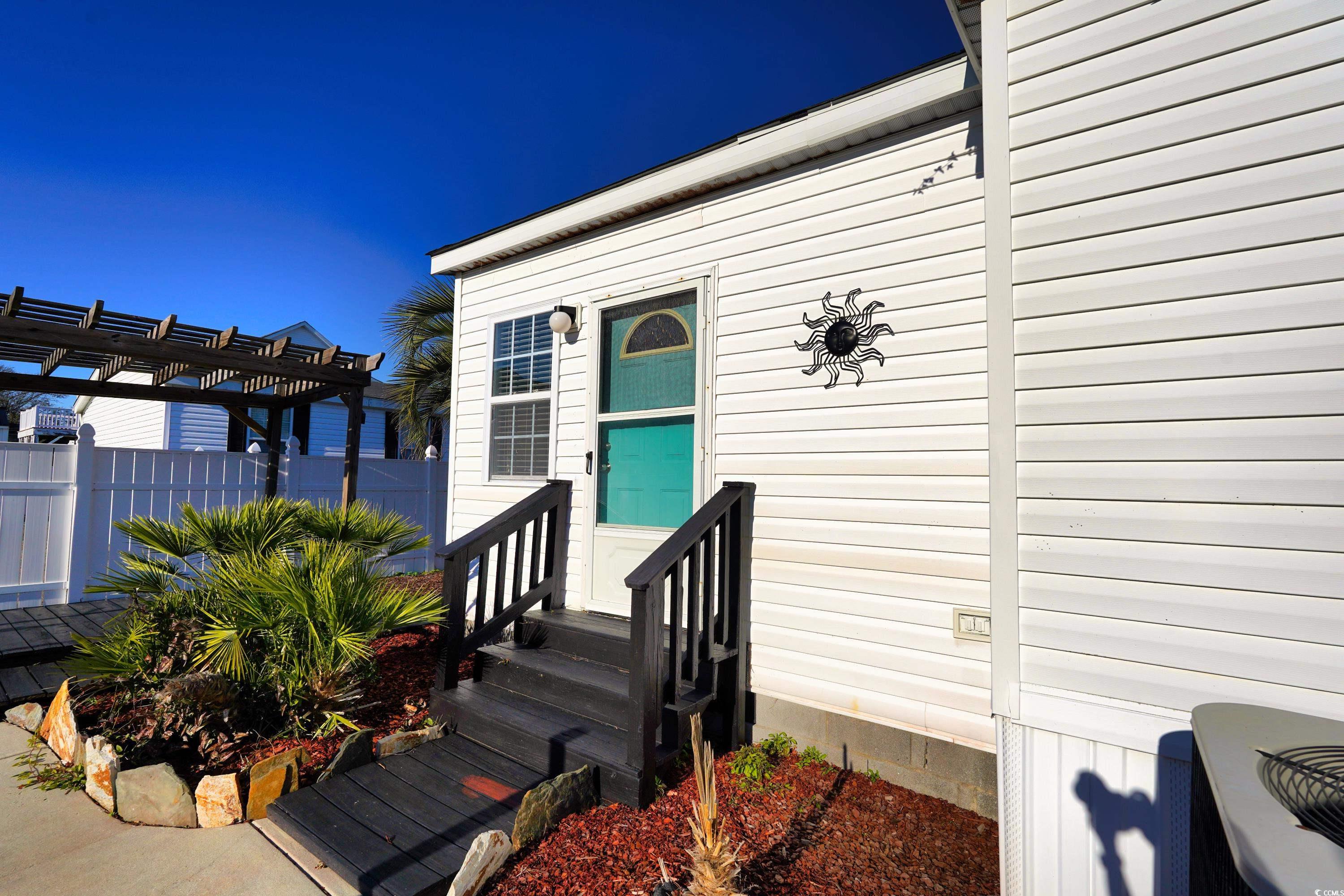 505 Rainbow Drive Murrells Inlet, SC 29576 - Photo 1 of 35 View of exterior entry featuring a pergola