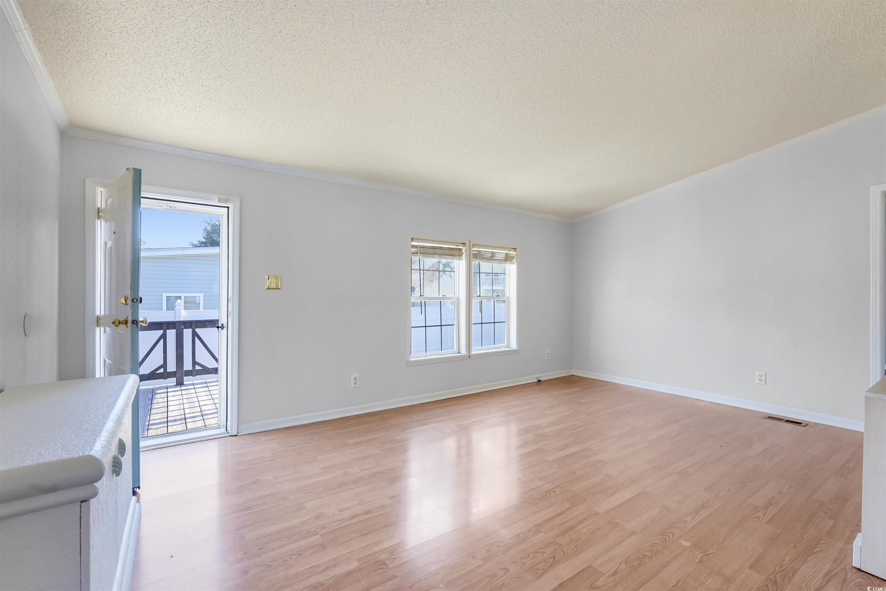 505 Rainbow Drive Murrells Inlet, SC 29576 - Photo 14 of 35 Unfurnished living room with a textured ceiling, o