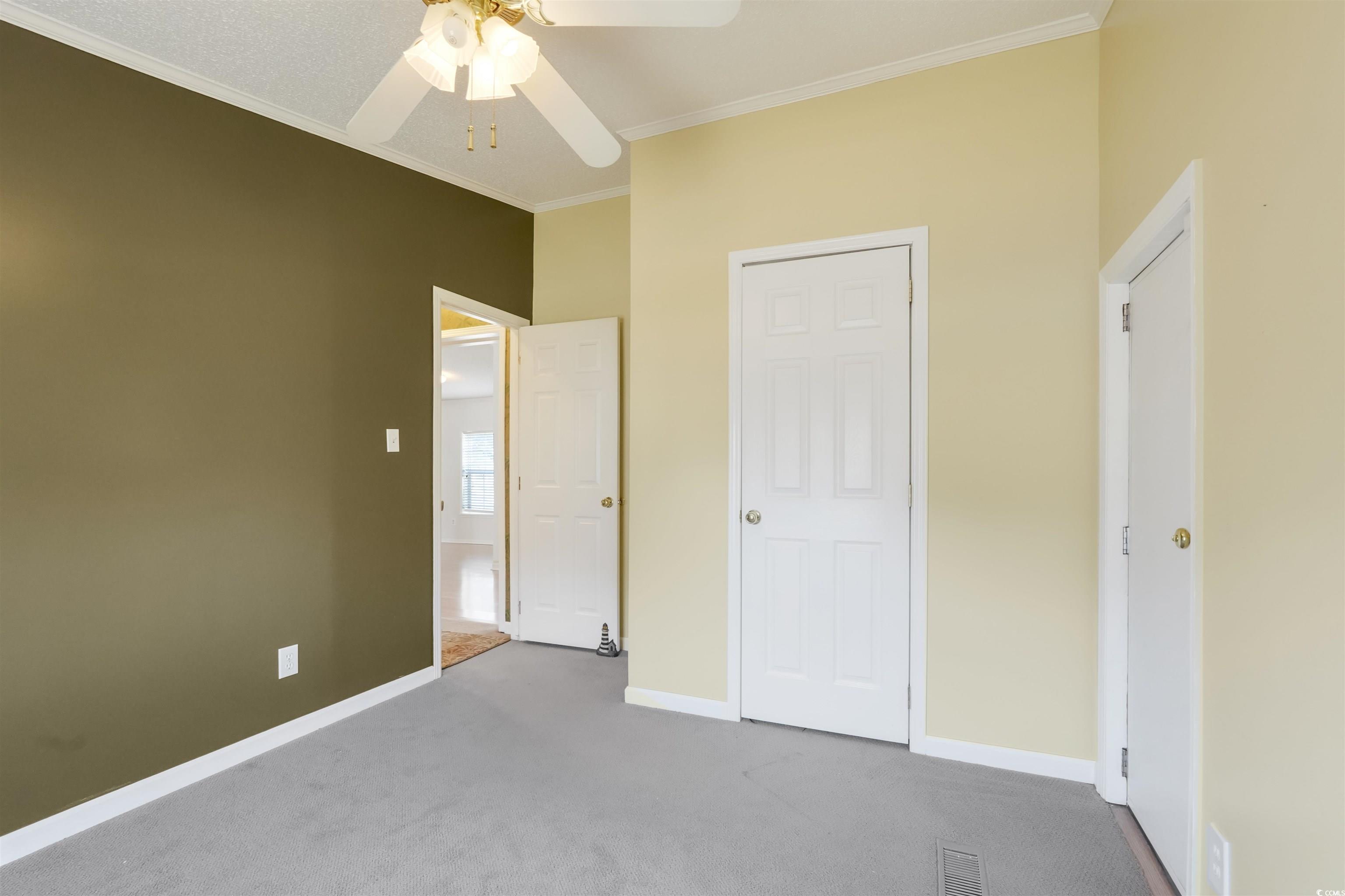 505 Rainbow Drive Murrells Inlet, SC 29576 - Photo 20 of 35 Unfurnished bedroom featuring ceiling fan, ornamen