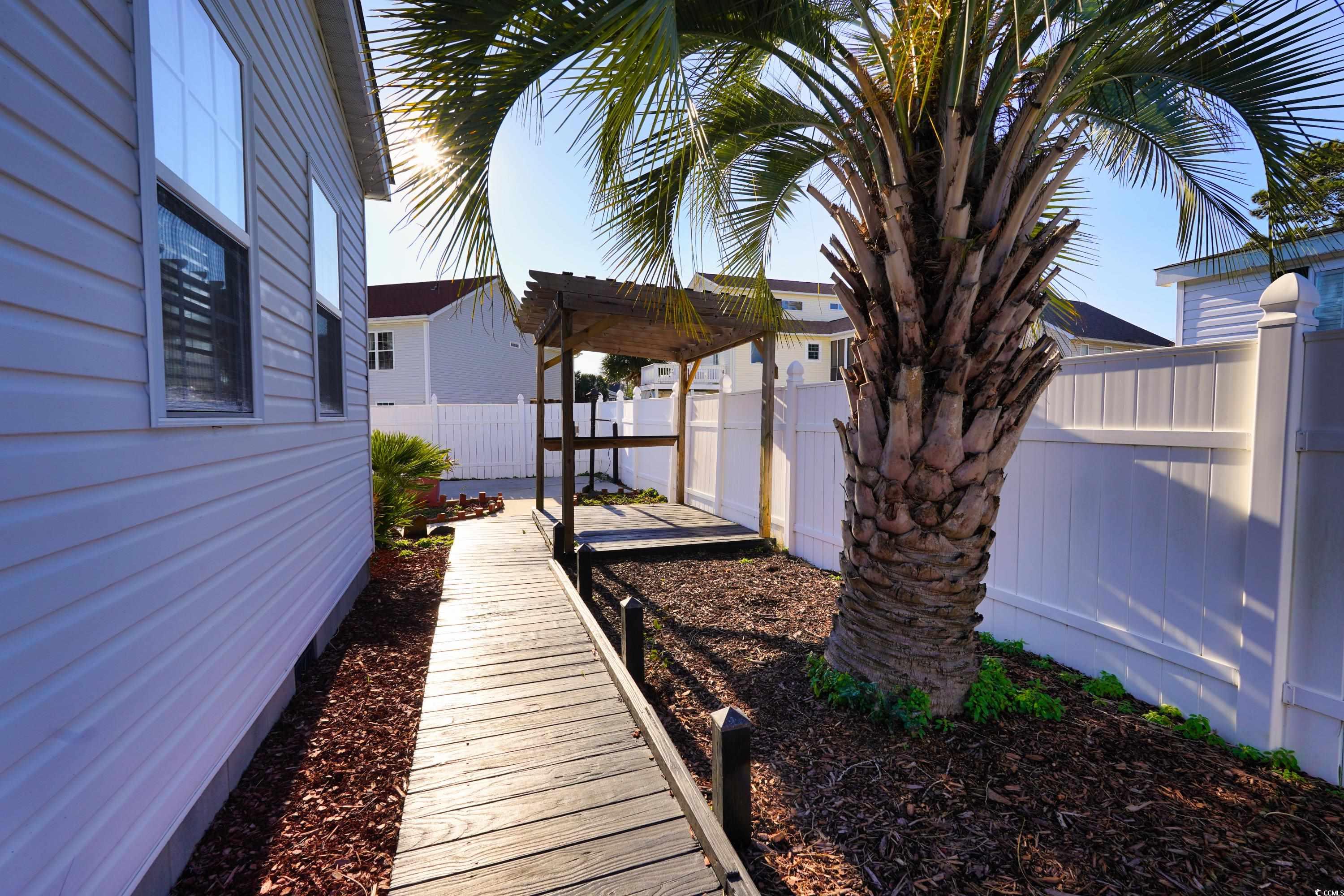 505 Rainbow Drive Murrells Inlet, SC 29576 - Photo 26 of 35 View of yard featuring a pergola