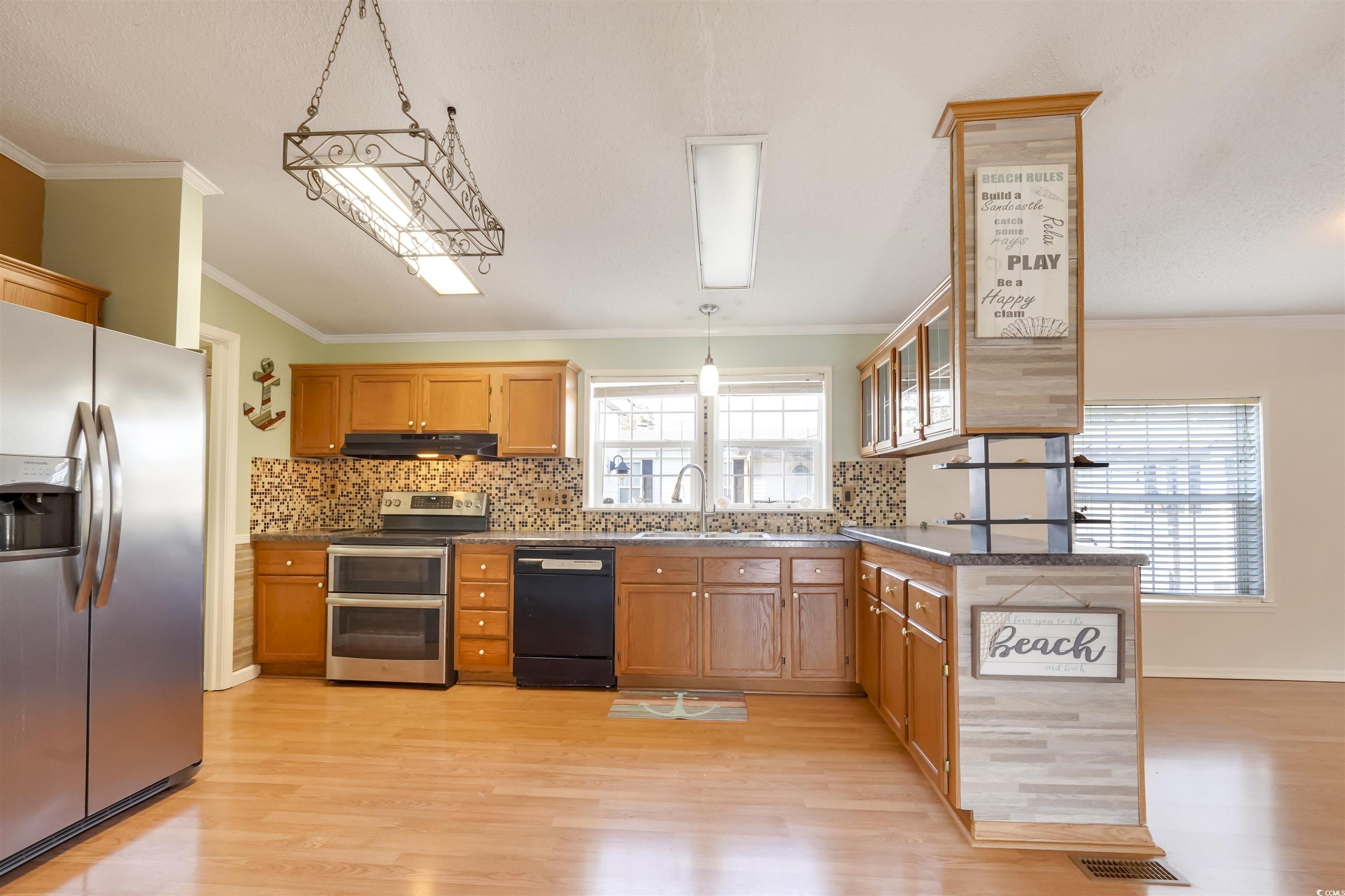 505 Rainbow Drive Murrells Inlet, SC 29576 - Photo 8 of 35 Kitchen featuring decorative light fixtures, plent