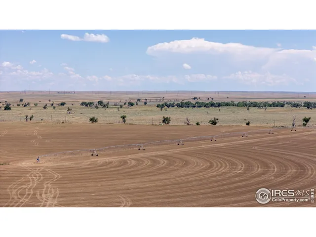 a view of a swimming pool and an outdoor seating