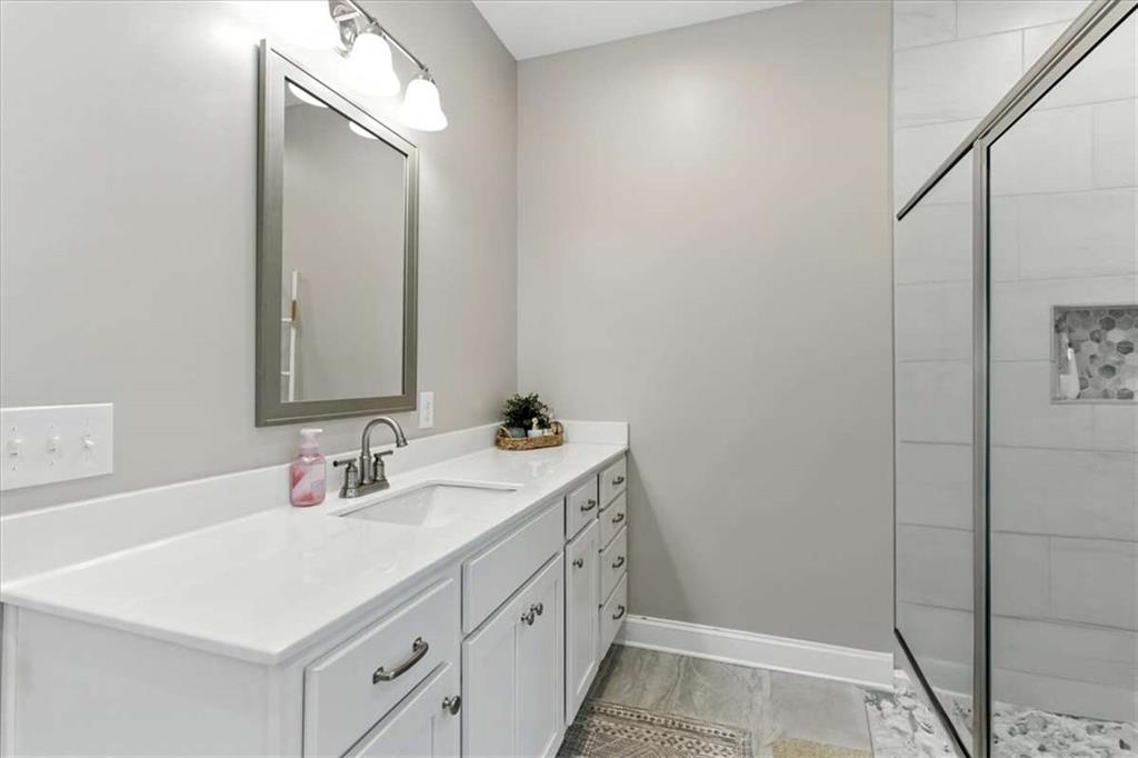 62 Joe Rowell Road Buchanan, GA 30113 - Photo 29 of 63 a bathroom with a sink and a mirror