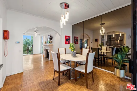 a kitchen with kitchen island granite countertop a sink counter and stainless steel appliances