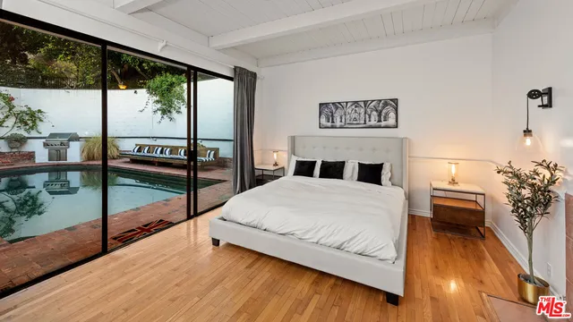 a bedroom with a bed and a view of bedroom