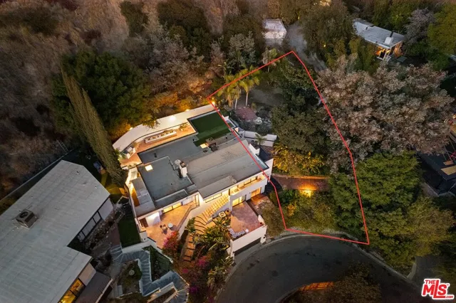 an aerial view of houses with yard