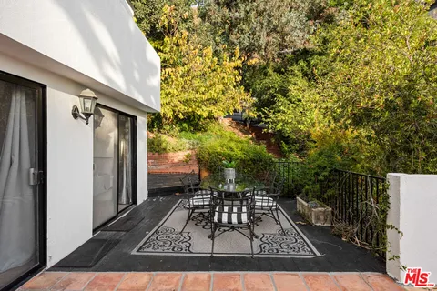 a living room with a table or chairs and a wooden floor