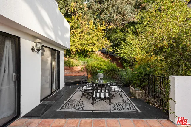 a living room with a table or chairs and a wooden floor