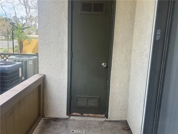 a kitchen with a refrigerator and a sink