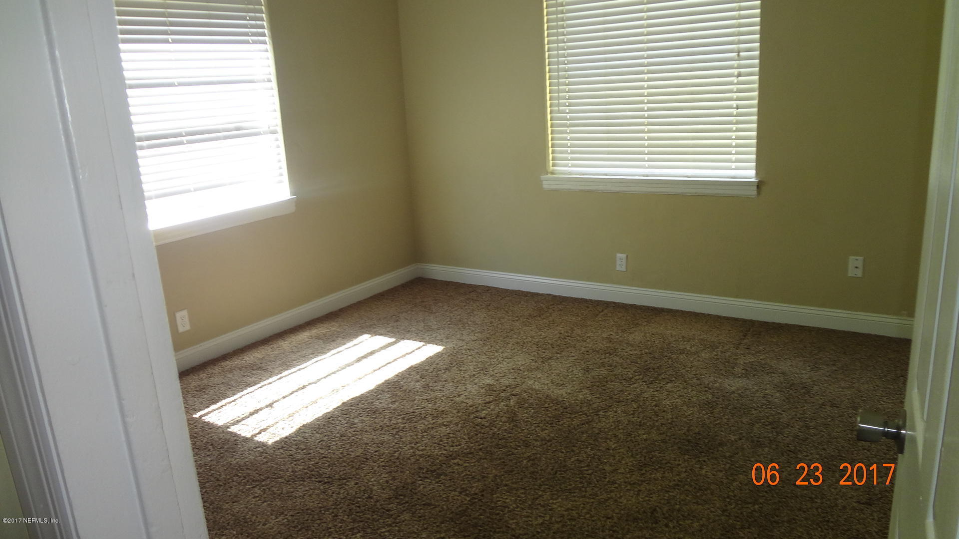 3337 Post Street, Unit 2 Jacksonville, FL 32205 - Photo 6 of 7 a view of an empty room with a window
