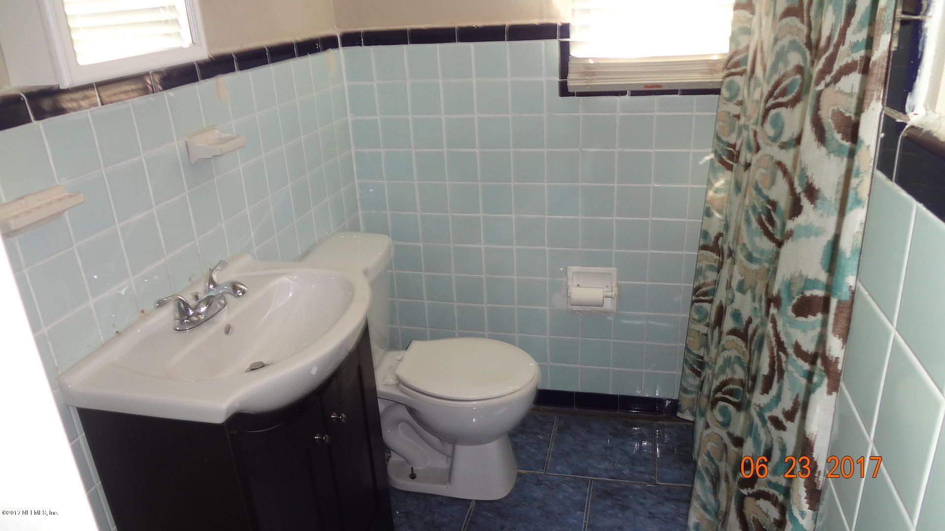 3337 Post Street, Unit 2 Jacksonville, FL 32205 - Photo 7 of 7 a bathroom with a sink and toilet
