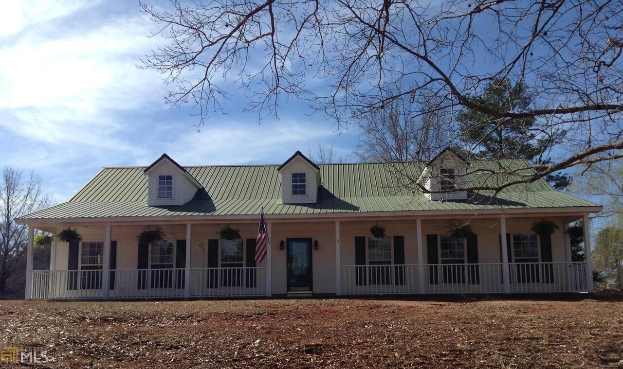 1126 Scott Branch Road Williamson, GA 30292 - Photo 1 of 1 a front view of a house with a garden