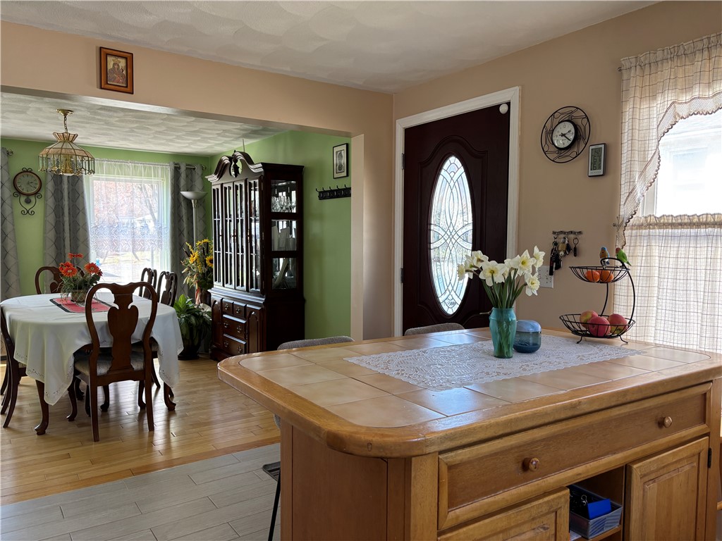 126 Lilac Avenue Woonsocket, RI 02895 - Photo 6 of 42 dining room is open to kitchen