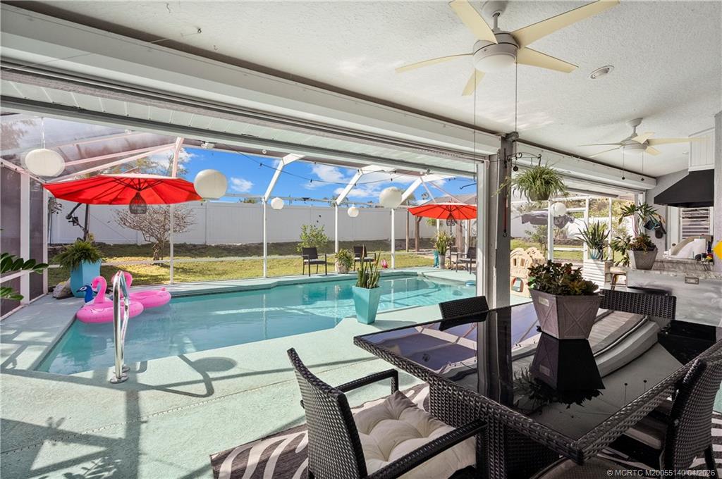 5688 Southeast Pot O Gold Place Stuart, FL 34997 - Photo 30 of 40 a outdoor view with a sitting space