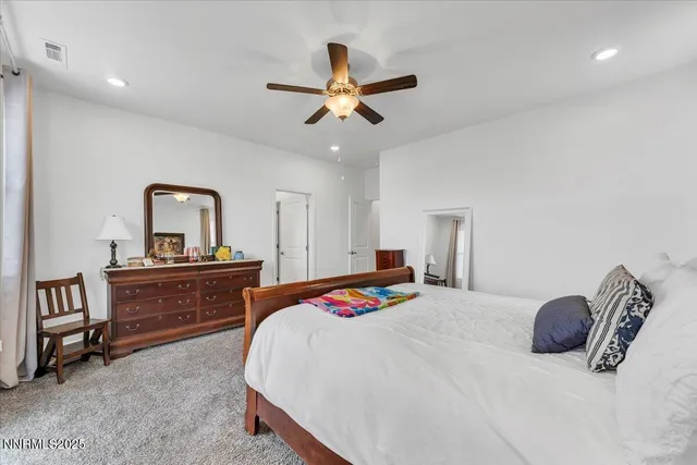 a spacious bathroom with a shower sink and mirror