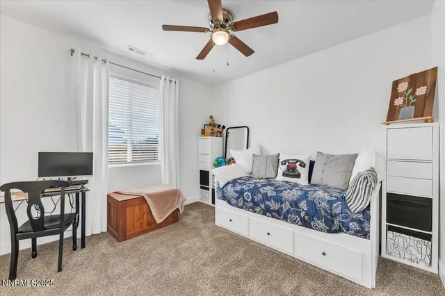 a storage and utility room with two washing machine
