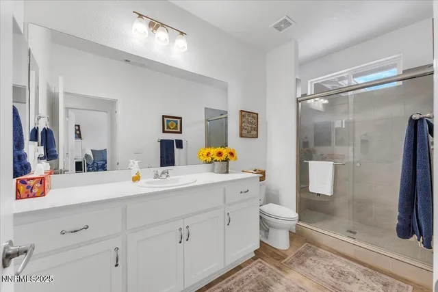 a view of a house with a backyard and potted plants