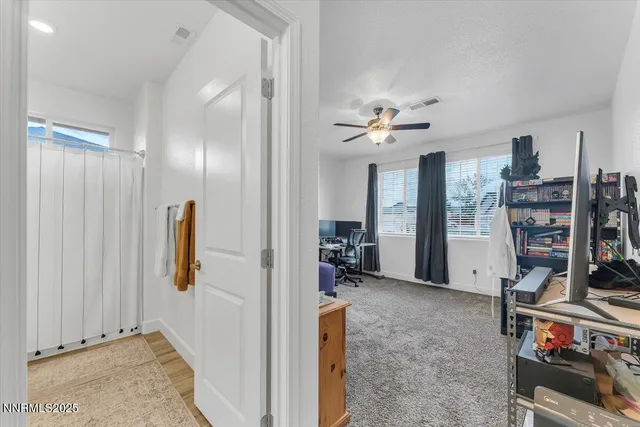 an aerial view of a house with a garden and mountain view