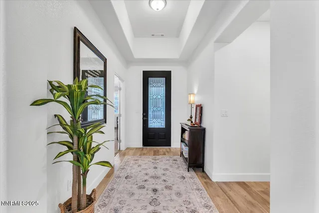 a living room with furniture and kitchen view