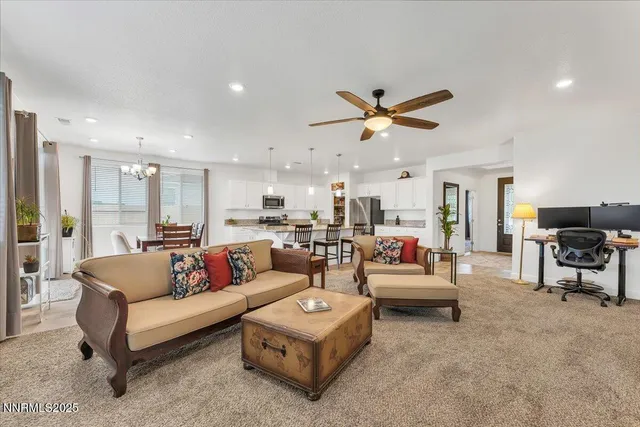 a kitchen with kitchen island a white counter top space a sink and appliances