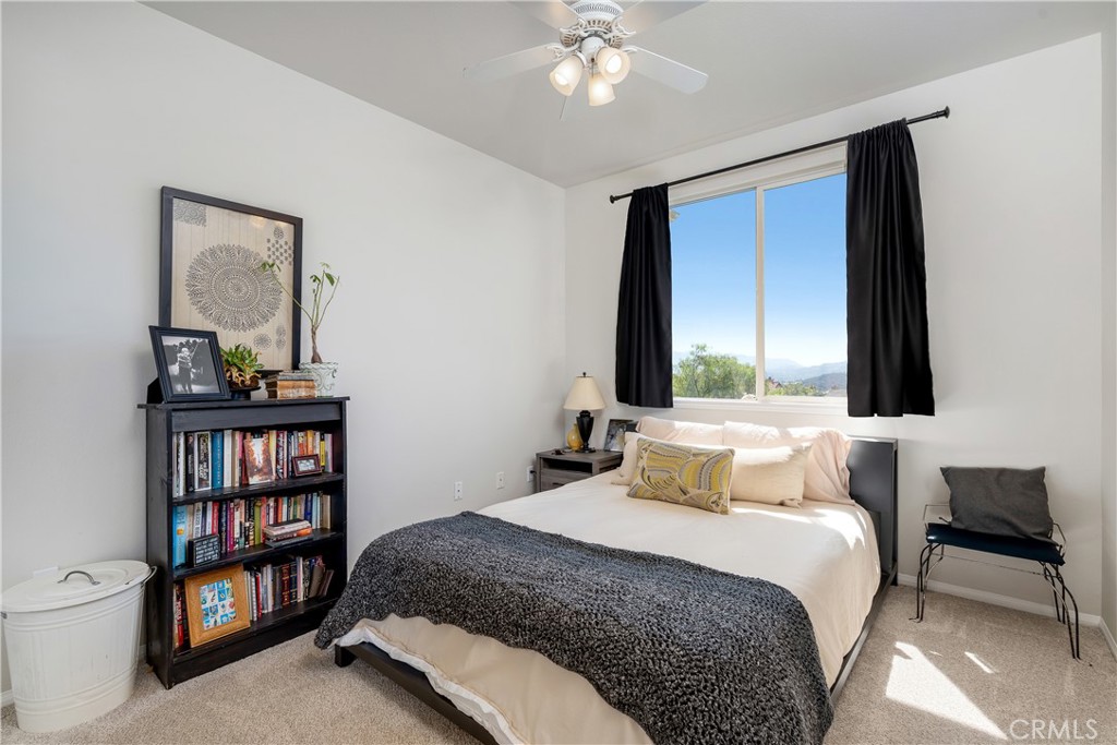 25730 Hawthorne Place Stevenson Ranch, CA 91381 - Photo 29 of 41 a bedroom with a bed furniture and a window