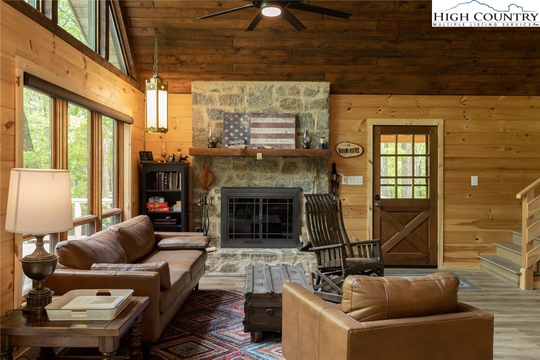 495 Horseshoe Ridge Road East Deep Gap, NC 28618 - Photo 11 of 33 a living room with furniture and a fireplace