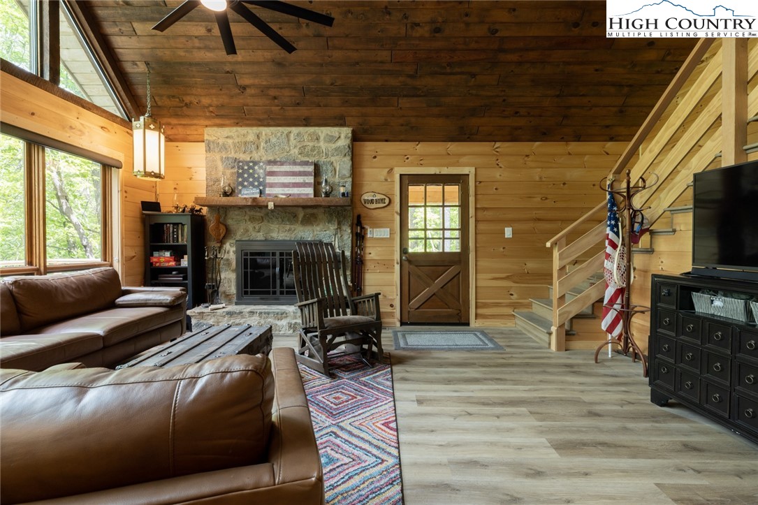 495 Horseshoe Ridge Road East Deep Gap, NC 28618 - Photo 16 of 33 a living room with furniture and a fireplace