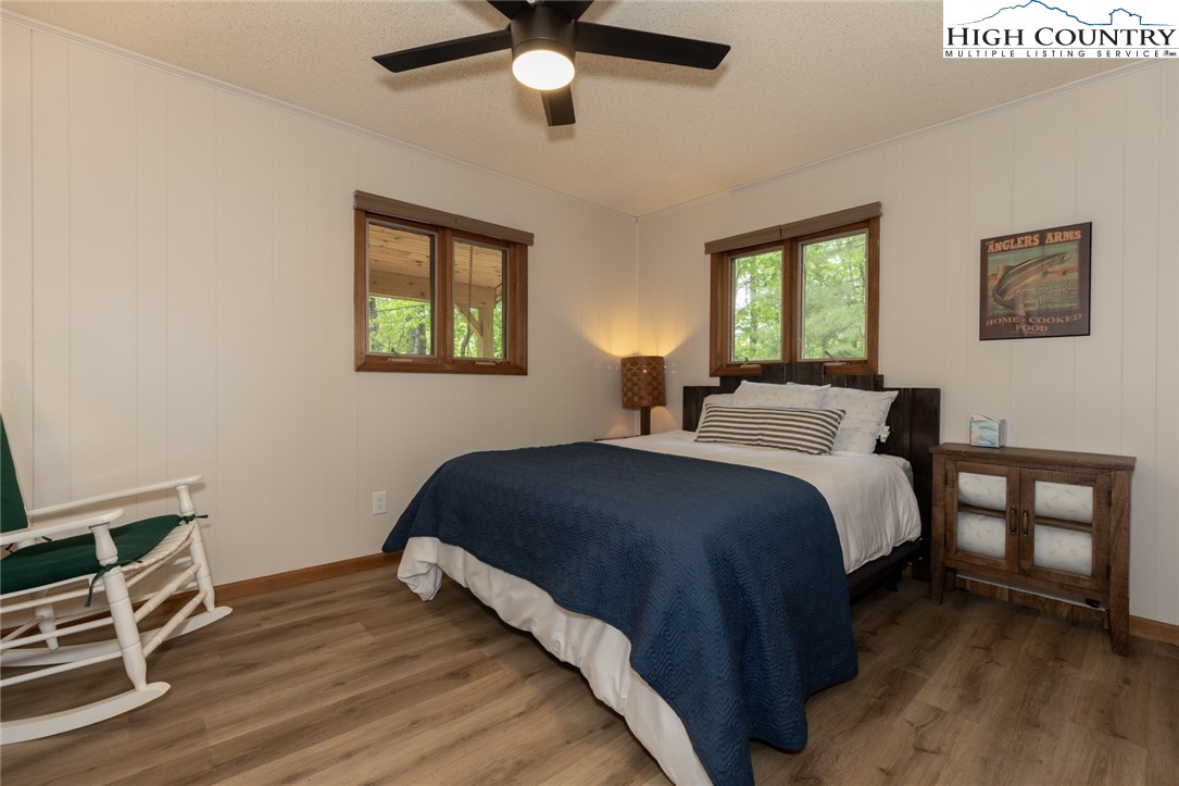 495 Horseshoe Ridge Road East Deep Gap, NC 28618 - Photo 18 of 33 a bedroom with a bed and a window