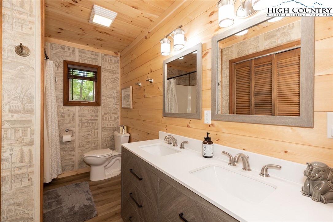 495 Horseshoe Ridge Road East Deep Gap, NC 28618 - Photo 19 of 33 a bathroom with a sink and a mirror