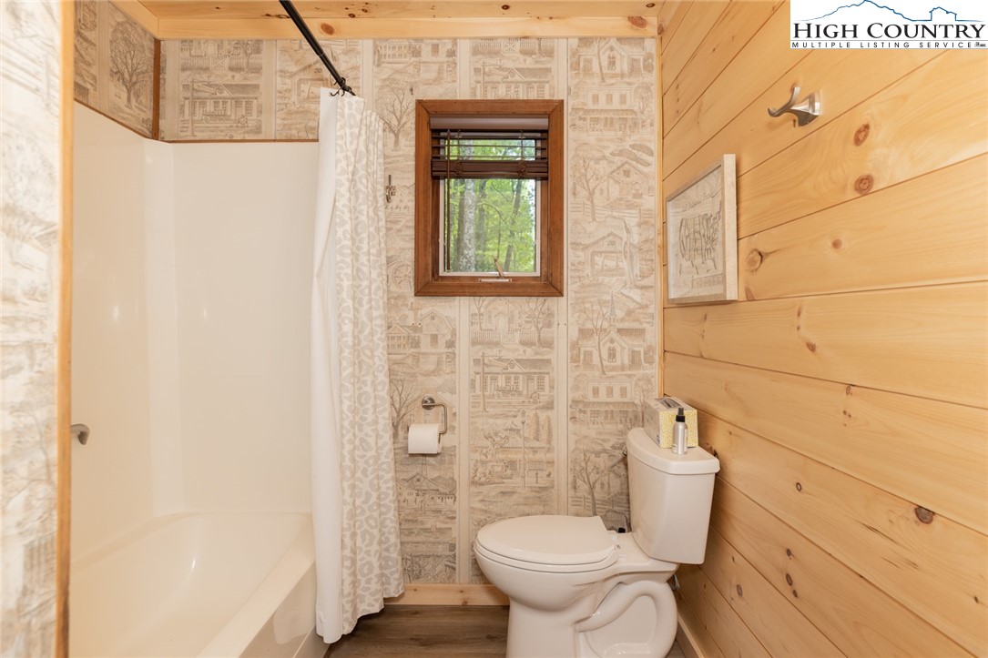 495 Horseshoe Ridge Road East Deep Gap, NC 28618 - Photo 20 of 33 a bathroom with a toilet and a shower