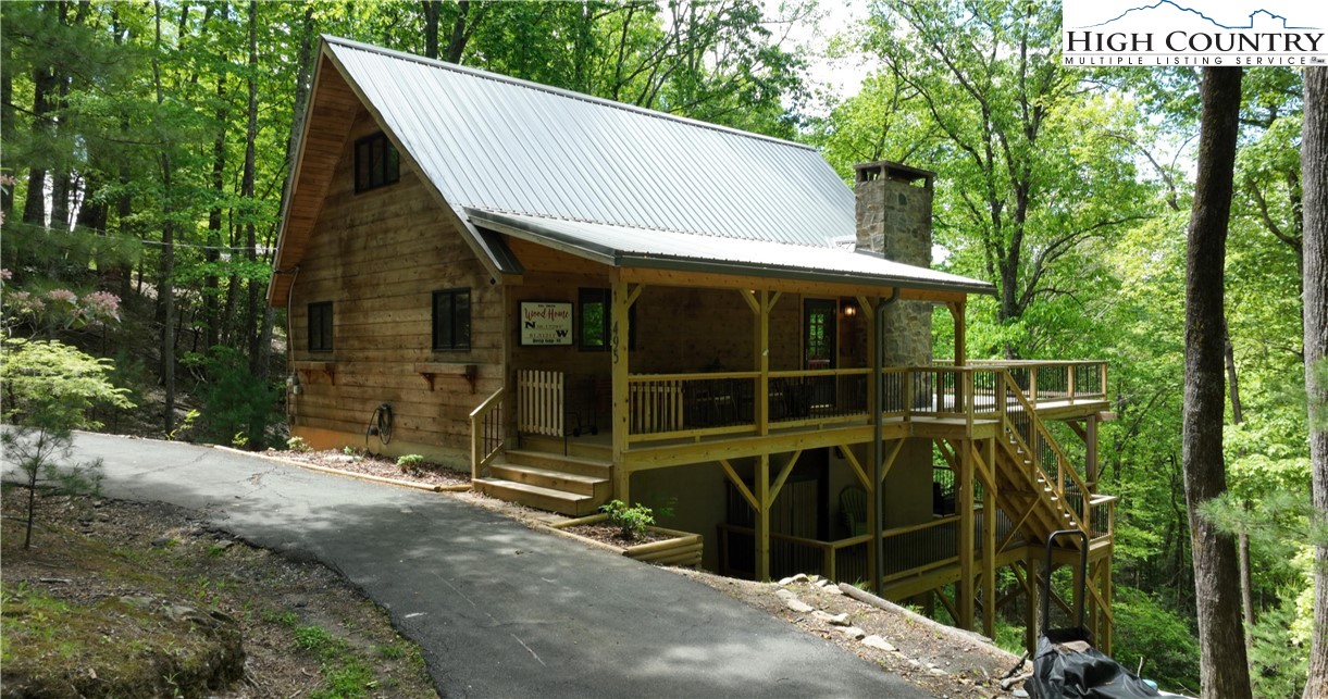 495 Horseshoe Ridge Road East Deep Gap, NC 28618 - Photo 2 of 33 a view of a house with a large window