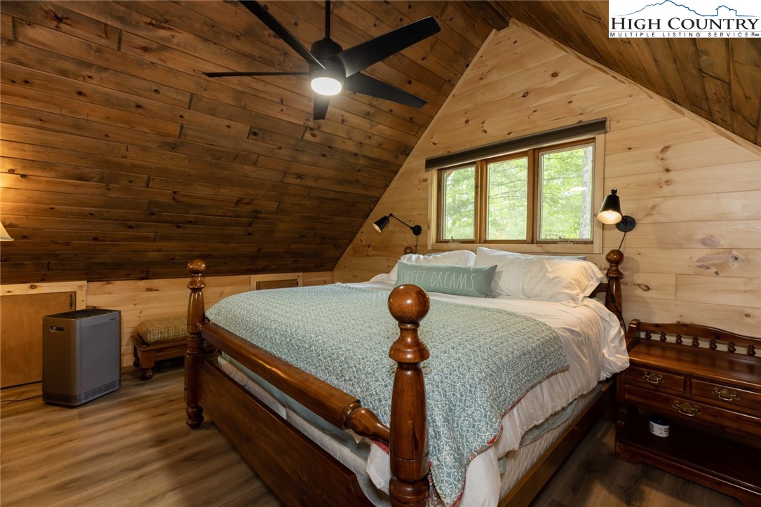 495 Horseshoe Ridge Road East Deep Gap, NC 28618 - Photo 24 of 33 a bed sitting in a bedroom next to a window