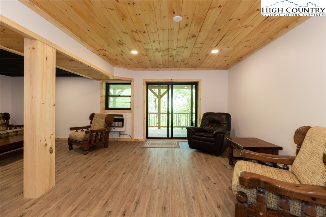 495 Horseshoe Ridge Road East Deep Gap, NC 28618 - Photo 26 of 33 a living room with furniture and a wooden floor