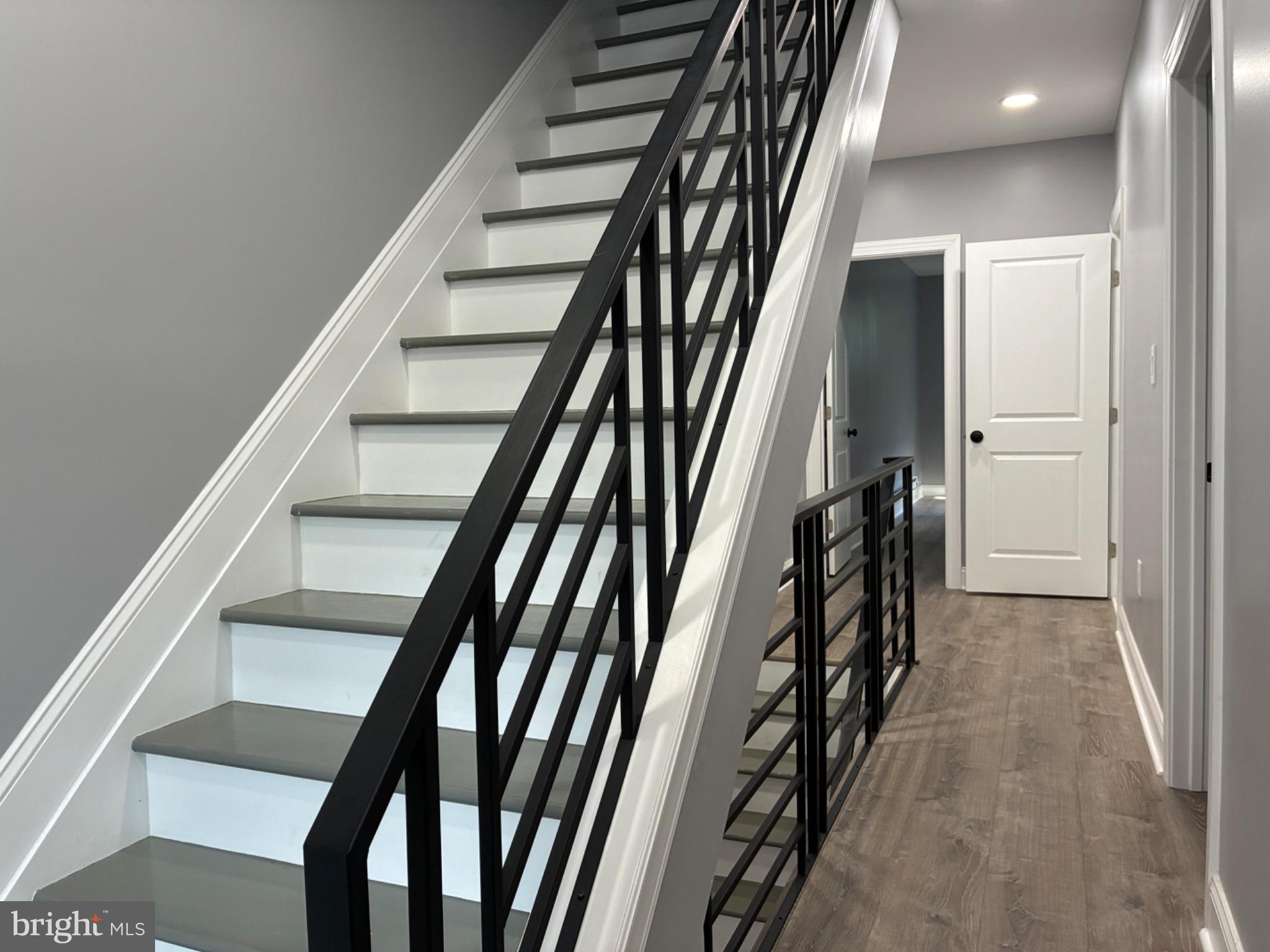 5812 Willows Avenue Philadelphia, PA 19143 - Photo 23 of 27 a view of staircase with wooden floor and stairs