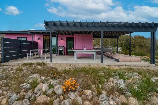 a kitchen with a table chairs stove and cabinets