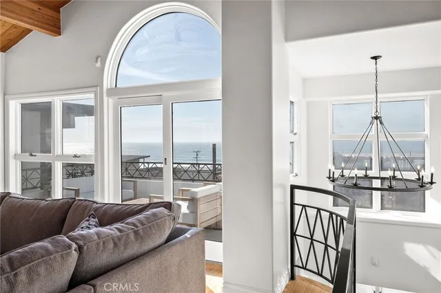 a terrace with outdoor seating and city view