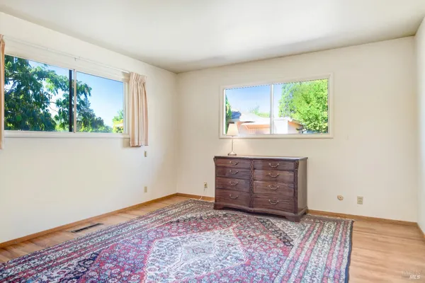 a room with a bed and a window