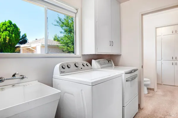 a utility room with dryer and washer