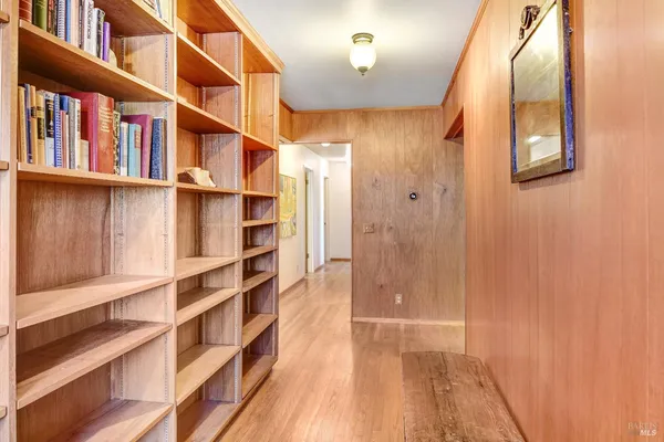 a view of walk in closet with empty room
