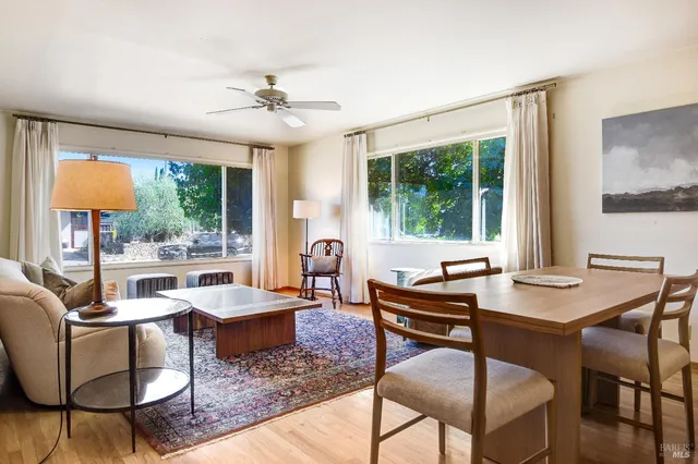 a view of a dining room with furniture window and outside view