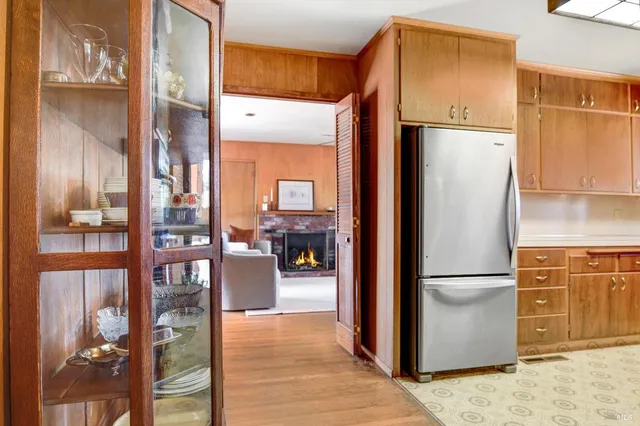 a kitchen with stainless steel appliances a refrigerator and a refrigerator