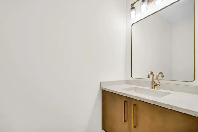 a view of a room with wooden floor and a window