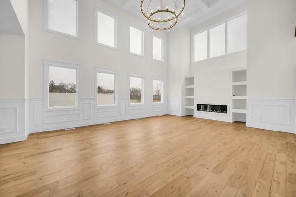 a large kitchen with kitchen island a sink a center island a stove and a window