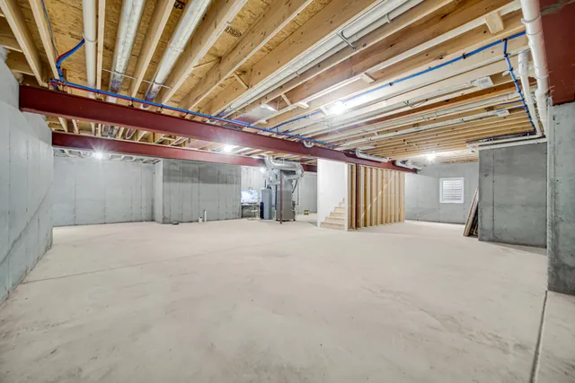 a view of a house with a big yard and large trees