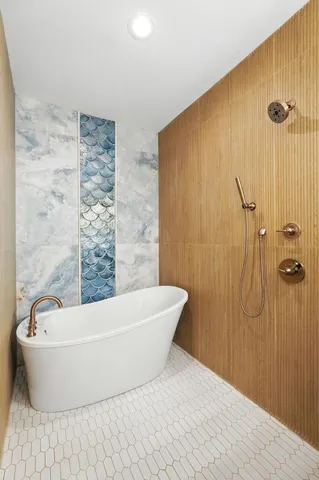 a white bath tub sitting in a bathroom